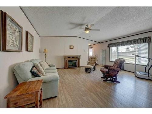 39070 Range Road 281, Rural Red Deer County, AB - Indoor Photo Showing Living Room With Fireplace