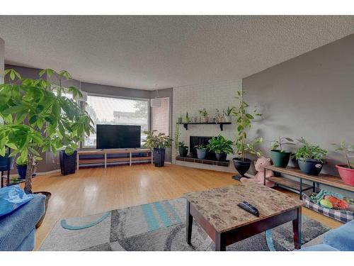 38 Wishart Street, Red Deer, AB - Indoor Photo Showing Living Room With Fireplace