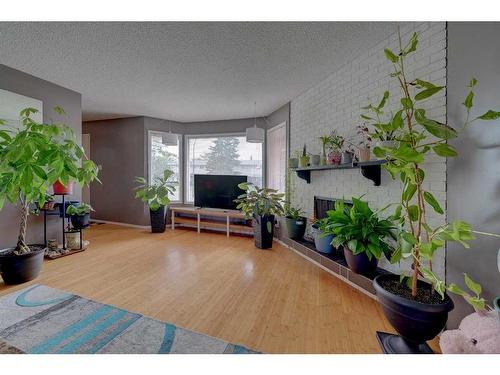 38 Wishart Street, Red Deer, AB - Indoor Photo Showing Living Room With Fireplace