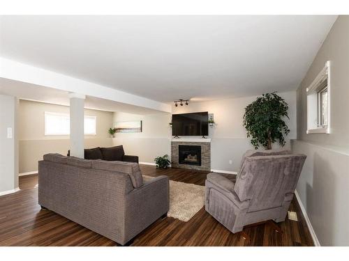 14-27501 Township Road 374, Rural Red Deer County, AB - Indoor Photo Showing Living Room With Fireplace