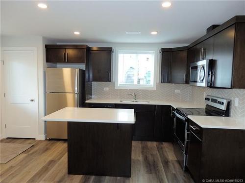 3720 47 Street, Red Deer, AB - Indoor Photo Showing Kitchen With Double Sink With Upgraded Kitchen