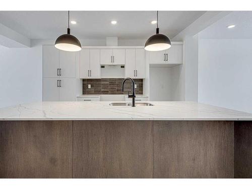 26 Lake Street, Rural Red Deer County, AB - Indoor Photo Showing Kitchen With Double Sink