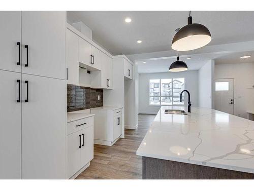 26 Lake Street, Rural Red Deer County, AB - Indoor Photo Showing Kitchen With Double Sink