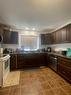 4626 Victoria Avenue, Coronation, AB  - Indoor Photo Showing Kitchen With Double Sink 