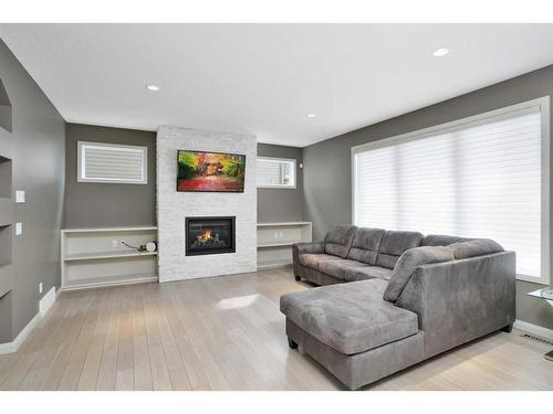 137 Sutherland Close, Red Deer, AB - Indoor Photo Showing Living Room With Fireplace