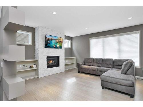 137 Sutherland Close, Red Deer, AB - Indoor Photo Showing Living Room With Fireplace