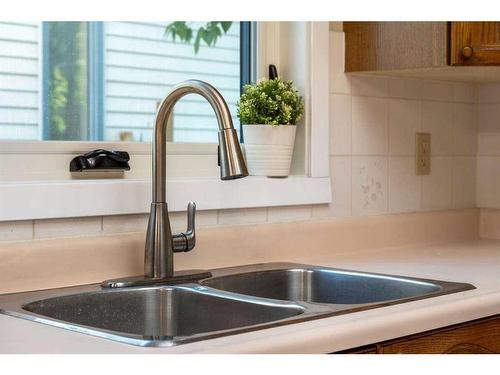 156 Millrise Close Sw, Calgary, AB - Indoor Photo Showing Kitchen With Double Sink