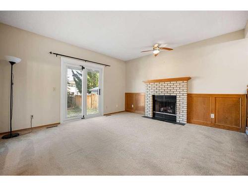 156 Millrise Close Sw, Calgary, AB - Indoor Photo Showing Living Room With Fireplace