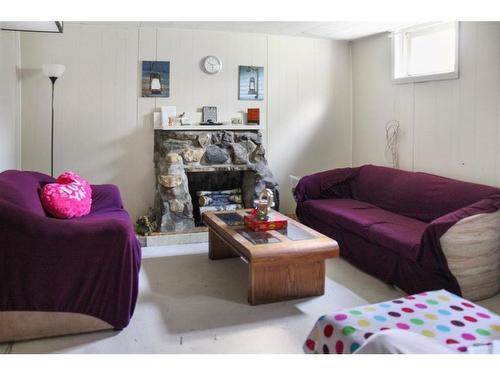 4840 48 Street, Hardisty, AB - Indoor Photo Showing Living Room With Fireplace