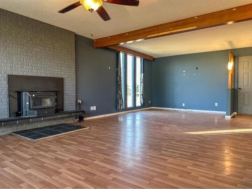 45466 Range Road 180, Rural Camrose County, AB - Indoor Photo Showing Living Room With Fireplace