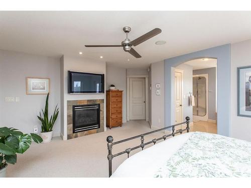 53 Allard Crescent, Red Deer, AB - Indoor Photo Showing Bedroom With Fireplace