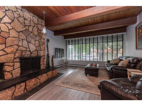 A-3737 50 Street, Red Deer, AB - Indoor Photo Showing Living Room With Fireplace