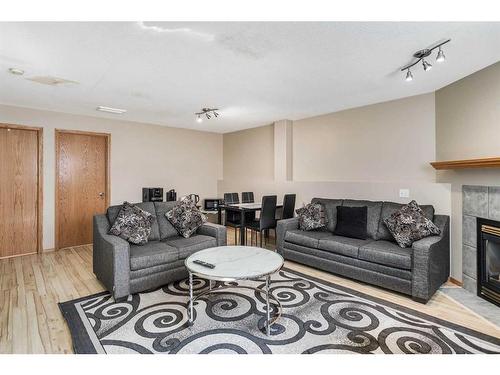 75 Kerr Close, Red Deer, AB - Indoor Photo Showing Living Room With Fireplace