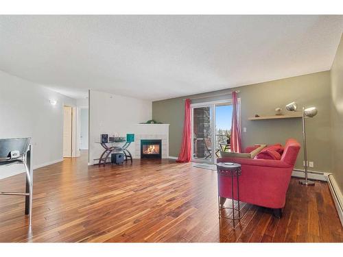 412-60 Lawford Avenue, Red Deer, AB - Indoor Photo Showing Living Room With Fireplace