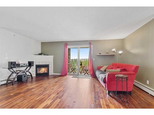 412-60 Lawford Avenue, Red Deer, AB - Indoor Photo Showing Living Room With Fireplace