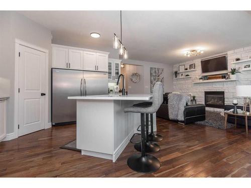 113 Weddell Crescent, Red Deer, AB - Indoor Photo Showing Kitchen With Fireplace With Upgraded Kitchen