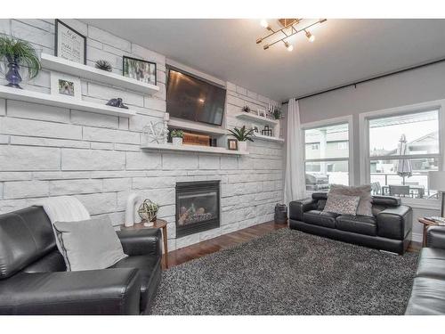 113 Weddell Crescent, Red Deer, AB - Indoor Photo Showing Living Room With Fireplace