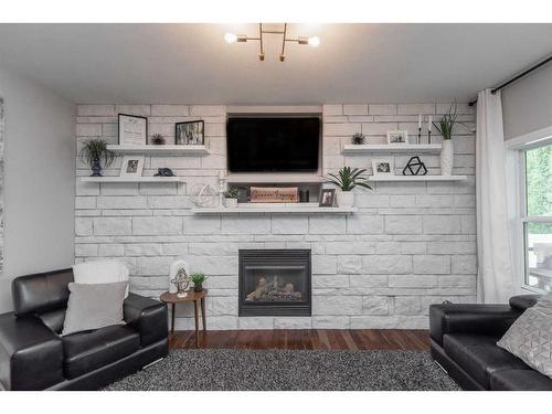 113 Weddell Crescent, Red Deer, AB - Indoor Photo Showing Living Room With Fireplace