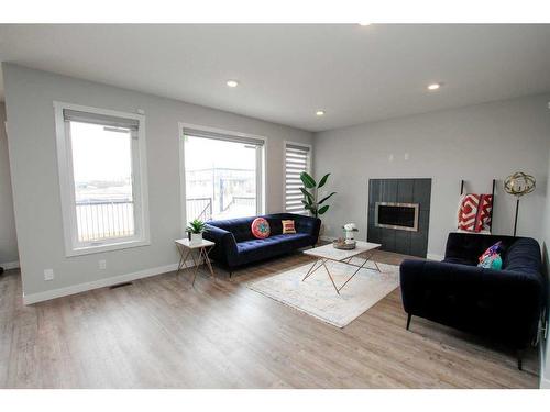 33 Larratt Close, Red Deer, AB - Indoor Photo Showing Living Room With Fireplace