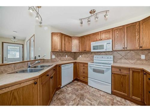 14-100 Legacy Lane, Rimbey, AB - Indoor Photo Showing Kitchen With Double Sink