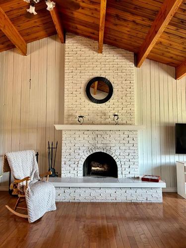 214 8 Avenue Ne, Sundre, AB - Indoor Photo Showing Living Room With Fireplace