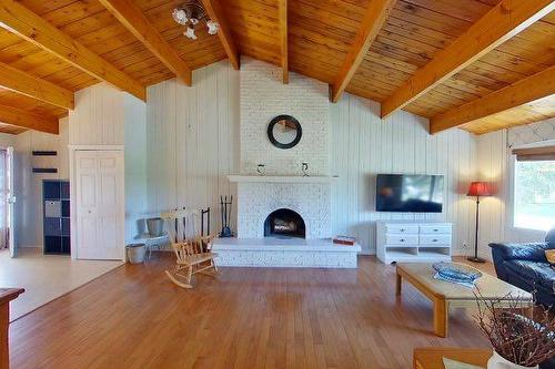 214 8 Avenue Ne, Sundre, AB - Indoor Photo Showing Living Room With Fireplace