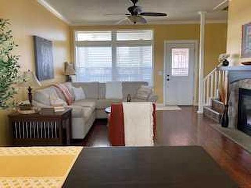 13 Cherry Se, Three Hills, AB - Indoor Photo Showing Living Room With Fireplace