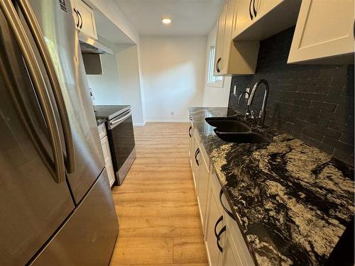 #F4-35 Nash Street, Red Deer, AB - Indoor Photo Showing Kitchen With Double Sink