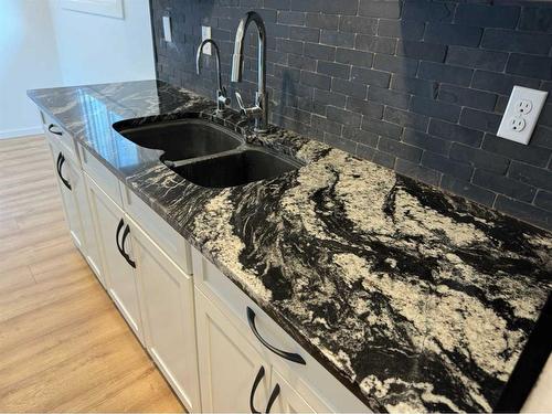 #F4-35 Nash Street, Red Deer, AB - Indoor Photo Showing Kitchen With Double Sink