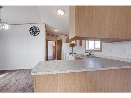 33073 Range Road 62, Rural Mountain View County, AB - Indoor Photo Showing Kitchen With Double Sink