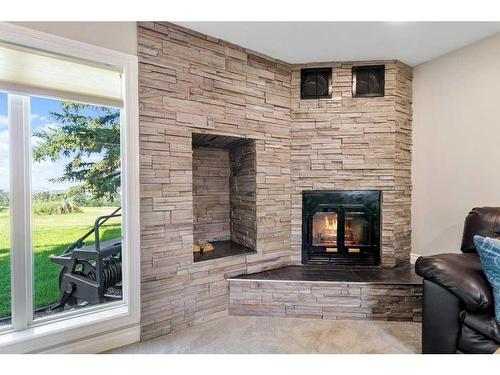 27007 Township Road 384, Rural Red Deer County, AB - Indoor Photo Showing Living Room With Fireplace