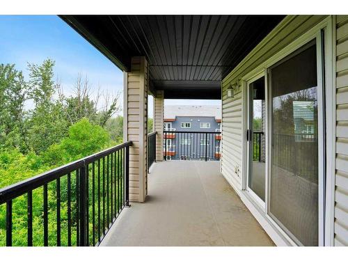 404-5601 Kerry Wood Drive, Red Deer, AB - Outdoor With Deck Patio Veranda With Exterior