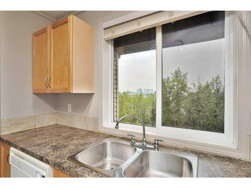 404-5601 Kerry Wood Drive, Red Deer, AB - Indoor Photo Showing Kitchen With Double Sink