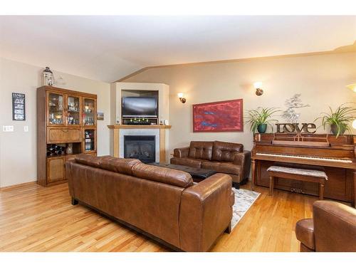 144 Ammeter Close, Red Deer, AB - Indoor Photo Showing Living Room With Fireplace