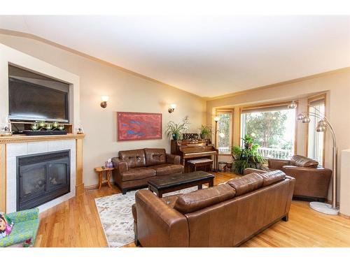 144 Ammeter Close, Red Deer, AB - Indoor Photo Showing Living Room With Fireplace