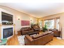 144 Ammeter Close, Red Deer, AB  - Indoor Photo Showing Living Room With Fireplace 