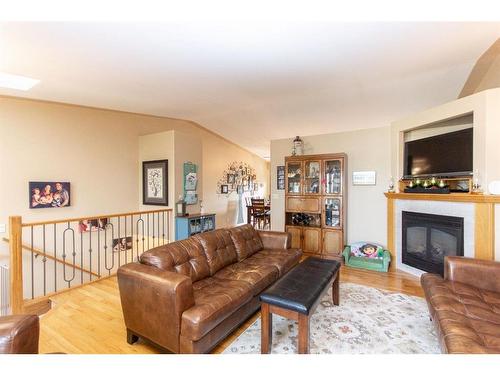 144 Ammeter Close, Red Deer, AB - Indoor Photo Showing Living Room With Fireplace