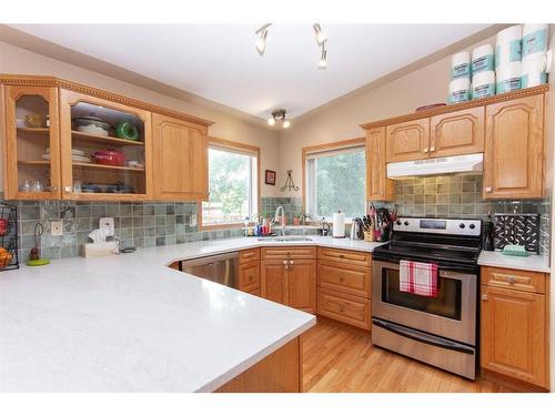 144 Ammeter Close, Red Deer, AB - Indoor Photo Showing Kitchen With Double Sink