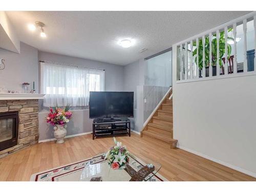 50 Jewell Street, Red Deer, AB - Indoor Photo Showing Living Room With Fireplace