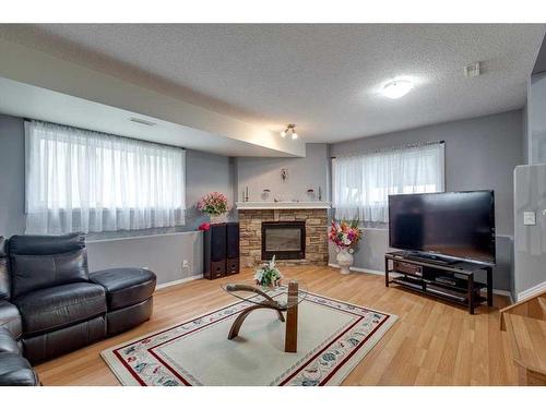 50 Jewell Street, Red Deer, AB - Indoor Photo Showing Living Room With Fireplace