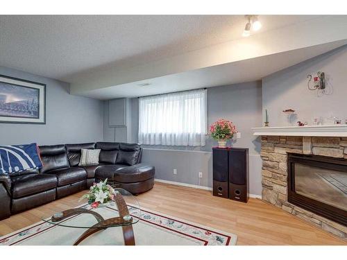 50 Jewell Street, Red Deer, AB - Indoor Photo Showing Living Room With Fireplace