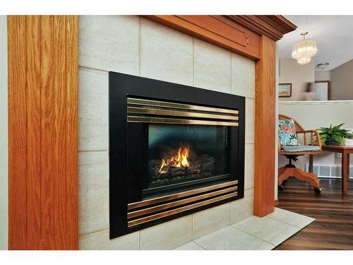 38 Langley Close, Lacombe, AB - Indoor Photo Showing Living Room With Fireplace