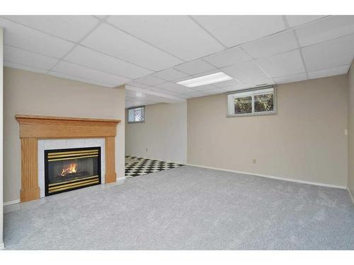 38 Langley Close, Lacombe, AB - Indoor Photo Showing Basement With Fireplace