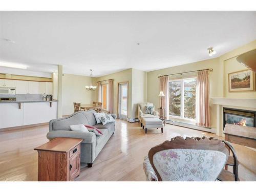 320-5300 48 Street, Red Deer, AB - Indoor Photo Showing Living Room With Fireplace