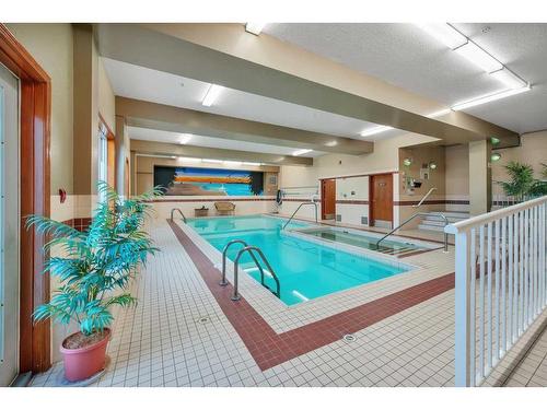 320-5300 48 Street, Red Deer, AB - Indoor Photo Showing Other Room With In Ground Pool