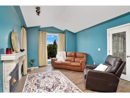 71 Anquetel Street, Red Deer, AB - Indoor Photo Showing Living Room With Fireplace