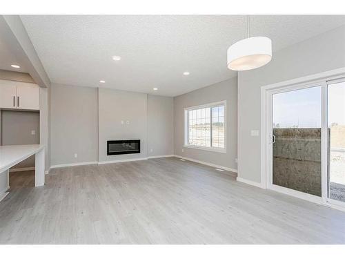 40 Key Cove Sw, Airdrie, AB - Indoor With Fireplace