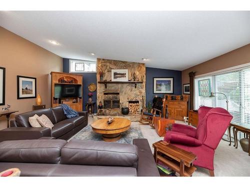 5432 58A Street Crescent, Lacombe, AB - Indoor Photo Showing Living Room With Fireplace