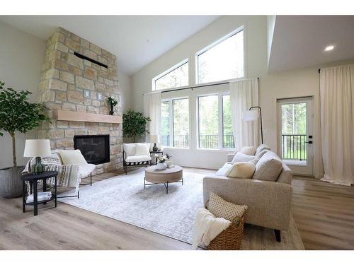 Meadow Ponds Drive, Rural Clearwater County, AB - Indoor Photo Showing Living Room With Fireplace