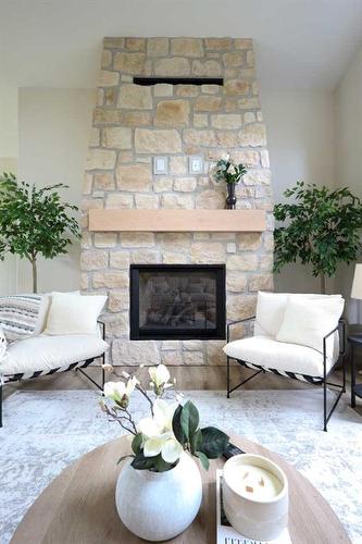 Meadow Ponds Drive, Rural Clearwater County, AB - Indoor Photo Showing Living Room With Fireplace